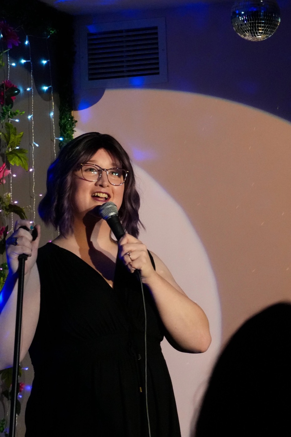 Roz Kennery performing stand-up comedy on stage